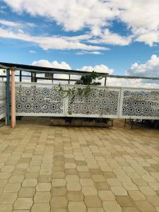 a white fence with a view of the ocean at Urban Escape in Nairobi