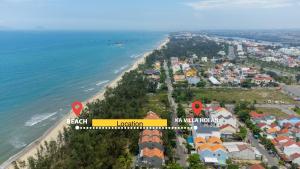 - une vue aérienne sur une plage avec des maisons et l'océan dans l'établissement KA Villa Hoi An, à Hội An