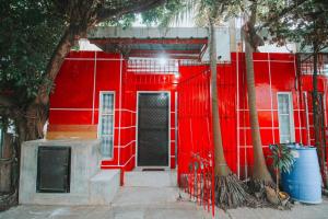 a red building with a gate and a red wall at RB Modern Condos in Zamboanga