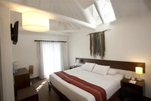 Rúm í herbergi á Tierra Viva Cusco Saphi Hotel