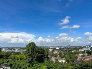 a view of a city with trees and buildings at Taiping City View Condo near Lake Garden/ Netflix in Taiping