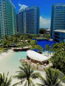 a resort with a large swimming pool and buildings at Holiday Escape Philippines in Manila