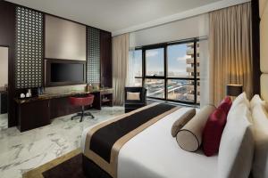 Postel nebo postele na pokoji v ubytování Millennium Place Dubai Marina