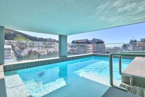 a large swimming pool on the roof of a building at City view studio apartment CBD in Cape Town