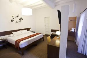 Rúm í herbergi á Tierra Viva Cusco Saphi Hotel