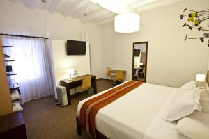 Rúm í herbergi á Tierra Viva Cusco Saphi Hotel