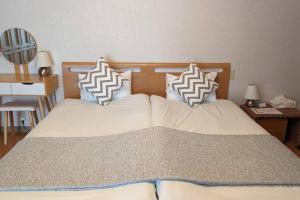 Postel nebo postele na pokoji v ubytování Roomy 4BR Home Sleeps 9／ShinOsaka／Large Groups + 37 fotografií