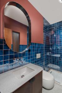 a bathroom with a sink and a toilet and a mirror at GentleTom in Istanbul +52 photos