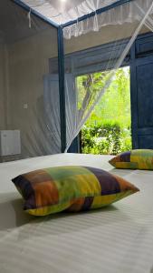 Postel nebo postele na pokoji v ubytování Kataragama Homestay + 37 fotografií