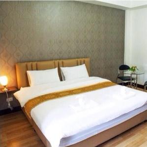 Postel nebo postele na pokoji v ubytování ตาฟ้าเรสซิเดนซ์ (Tafah Residence) + 7 fotografií