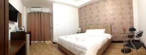 En eller flere senge i et værelse på ตาฟ้าเรสซิเดนซ์ (Tafah Residence)
