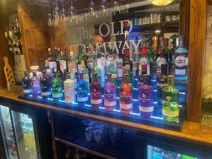 a bar filled with lots of bottles of alcohol at The Old Tramway - Stay in YOUR Motorhome - parking space on the car park in Stratford-upon-Avon