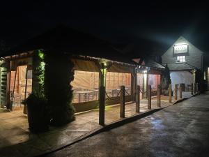 a wedding venue with a tent at night at The Old Tramway - Stay in YOUR Motorhome - parking space on the car park in Stratford-upon-Avon