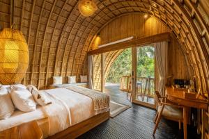 Postel nebo postele na pokoji v ubytování Jungleight Bali
