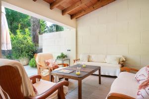a living room with a couch and a table at Ca na Carmen -Crestatx- in Crestatx