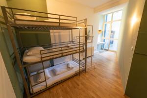 a room with two bunk beds in a room at Sishaus Hostel in Graz