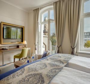 Postel nebo postele na pokoji v ubytování Hotel Am Leuchtturm