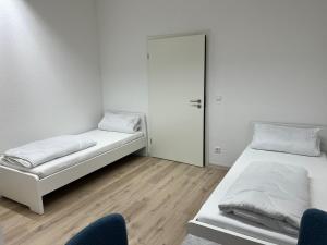 Una cama o camas en una habitación de Hannover 24 S