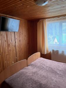 Postel nebo postele na pokoji v ubytování Cottage u Romana