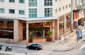 a car parked on a street in front of a building at INNSiDE by Meliá Barcelona Apolo in Barcelona
