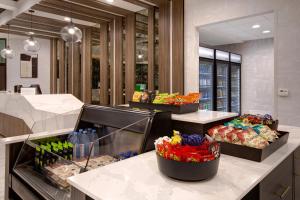 a food counter in a store with lots of food at Crowne Plaza Auburn Hills, an IHG Hotel in Auburn Hills