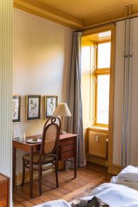Un ou plusieurs lits dans un hébergement de l'établissement Rye115 Hotel
