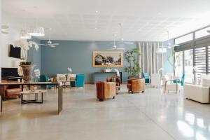TV a/nebo společenská místnost v ubytování Hotel Le Saint Pierre ÎLe De La Reunion.