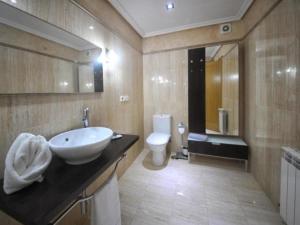 a bathroom with a sink and a toilet at 0322 Apartment in Carballo in Carballo