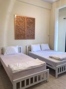 Postel nebo postele na pokoji v ubytování Joox B - Serviced Apartment