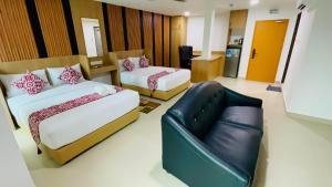 Postel nebo postele na pokoji v ubytování Cozy Hotel@ KL Sentral
