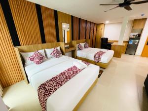 Postel nebo postele na pokoji v ubytování Cozy Hotel@ KL Sentral