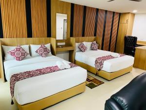 Postel nebo postele na pokoji v ubytování Cozy Hotel@ KL Sentral