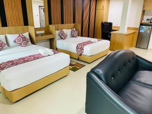 Postel nebo postele na pokoji v ubytování Cozy Hotel@ KL Sentral