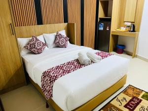 Postel nebo postele na pokoji v ubytování Cozy Hotel@ KL Sentral