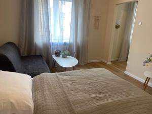 Ένα ή περισσότερα κρεβάτια σε δωμάτιο στο STING Apartments Havířov