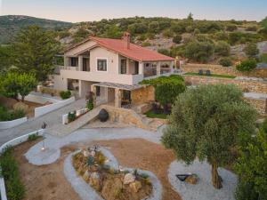 an aerial view of a house with a yard at Chariclea Villas Retreat in Samos