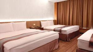 Postel nebo postele na pokoji v ubytování Zhong Ke Hotel
