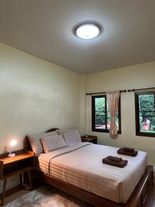 Postel nebo postele na pokoji v ubytování ViangPhing Resort
