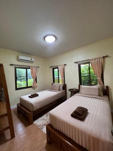 Postel nebo postele na pokoji v ubytování ViangPhing Resort