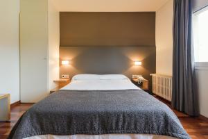 Voodi või voodid majutusasutuse Hotel Robert toas