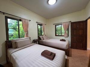 Postel nebo postele na pokoji v ubytování ViangPhing Resort