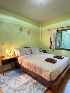Postel nebo postele na pokoji v ubytování ViangPhing Resort