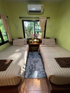 Postel nebo postele na pokoji v ubytování ViangPhing Resort