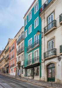 a colorful building on the side of a street at Ama Apartments in Lisbon