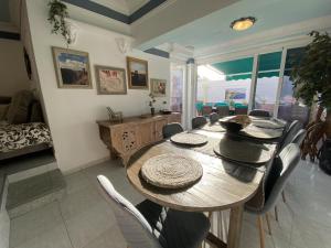 a dining room with a table and chairs at The Good Life Holiday Home in Adeje