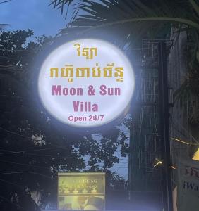 a sign for a moon and sun villa on a building at Moon and Sun Villa in Phnom Penh