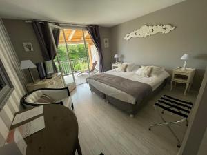 Postel nebo postele na pokoji v ubytování HOTEL LE MAS D'HèLèNE