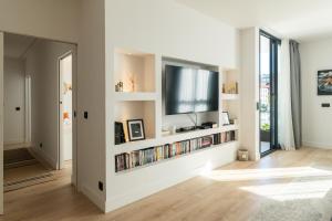 a living room with a flat screen tv on a wall at Riverview apartamento en LLanes in Llanes