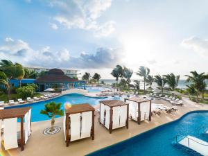 an aerial view of a resort with a pool at Azul Beach Resort Riviera Cancun, Gourmet All Inclusive by Karisma in Puerto Morelos