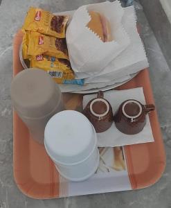 a tray of food with food and drinks on it at Hotel Ferrari in Sao Paulo